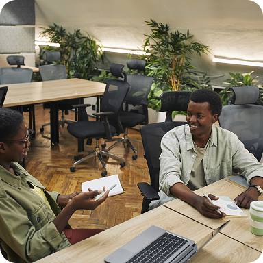 Two Bamboo team members collaborating at a desk